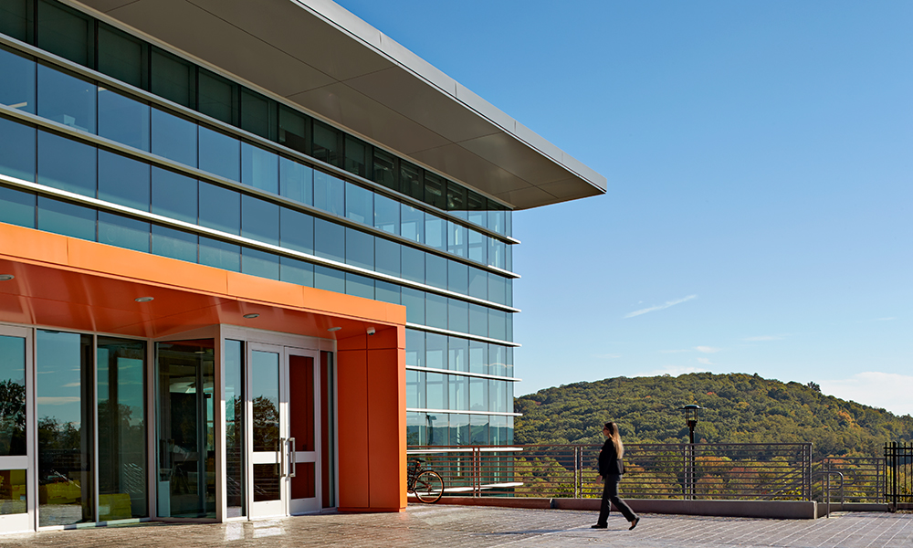 <p>To control solar heat gain, the curtain wall incorporates horizontal and vertical shading devices – depending on orientation. Flourishes of color are added on the metal framing of the glass and main entry canopies. The materials palette is very simple, with precast concrete, pre-finished metal panels, pre-finished aluminum and glass curtain wall and pre-finished aluminum and glass window units. </p>
