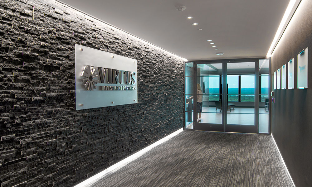 <p>Stepping off the elevators on the firm’s main floor, one is led down a dramatic hallway with stacked black stone toward a reception area flooded in natural light. Spectacular views of the region, including the Connecticut River and the Travelers Tower, are seemingly within reach.</p>
