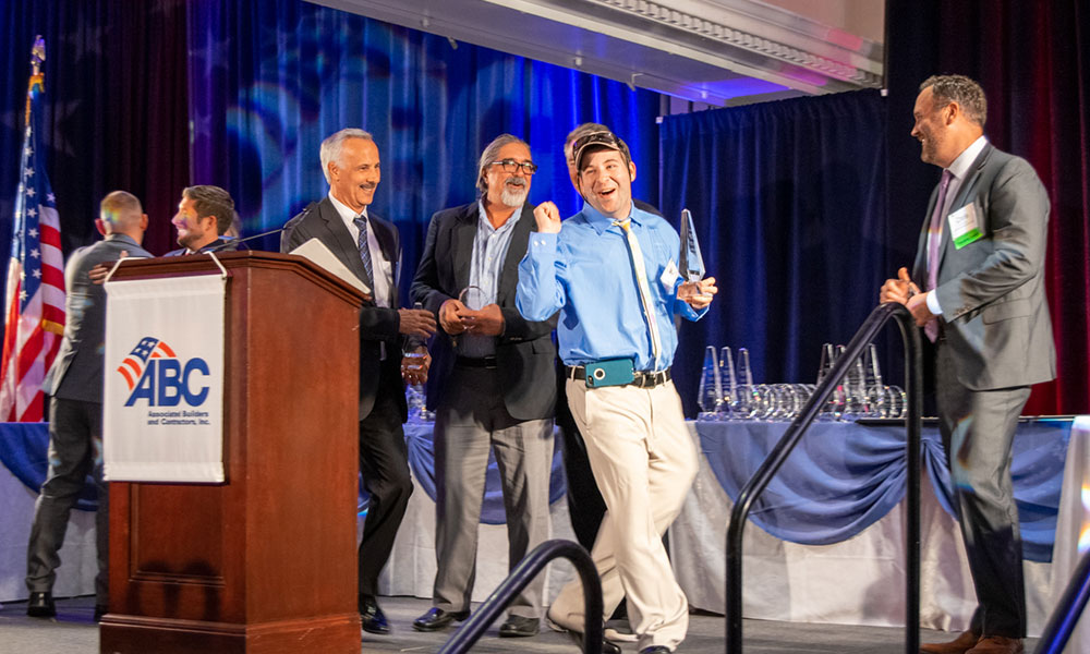 <p>Matt Baker, a Chapel Haven resident and building committee member, accepted one of several awards the REACH project has received.</p>
