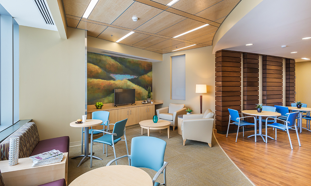 <p>The entrance onto each floor from a set of new visitor elevators is defined by dedicated family space. This daylit space with great views serves to provide a positive first impression upon entering the unit and aid in way-finding by establishing a distinct and memorable reception point.  This area includes comfortable seating areas, private consult space and even a small kitchen to complement the family experience and create a true on floor respite.</p>
