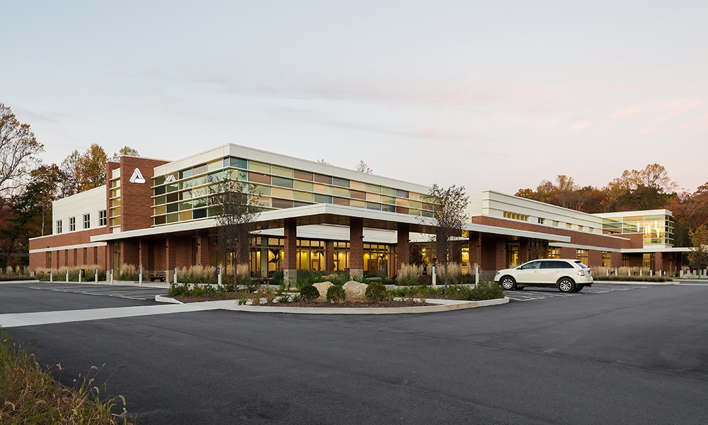 <p>An energetic architecture holds its own in an intensive retail context. A blend of elements established at the main hospital campus ( brick panels and precast concrete banding ) and local shoreline influences (natural stone, sea glass and native planting) defines the new center and reinforces an identifiable, system-wide aesthetic.</p>
