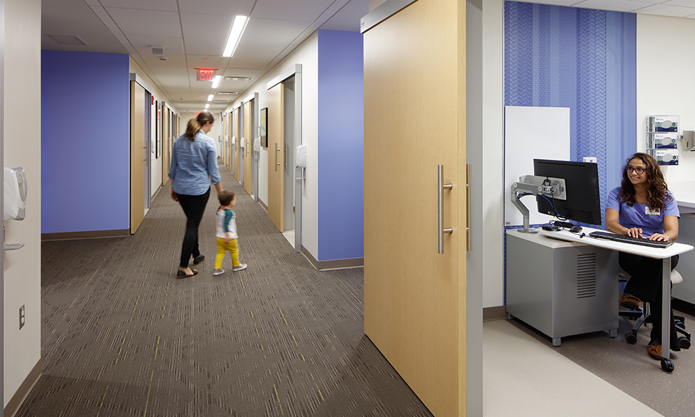 <p>To reduce stress and travel for patients and families, multiple services are provided within the exam room, including weight and height checks, blood work, ancillary services, and scheduling. This new patient experience is a result of the LEAN process in early design and operational analysis.</p>
