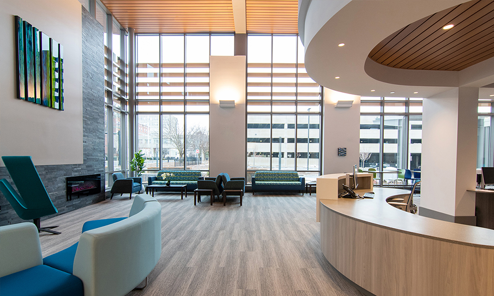 <p>The center’s waiting areas are bathed in natural light and soothing colors and offer an array of seating options.</p>
