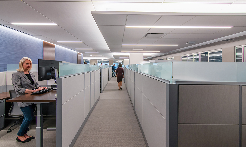 <p>The open plan design features typical size support staff workstations. The perimeter of the floor plate was planned as a move to the single standard office footprint of 150-SF, shows Murtha Cullina’s novel democratic approach to space regardless of title or tenure between levels of partners and associates.</p>
