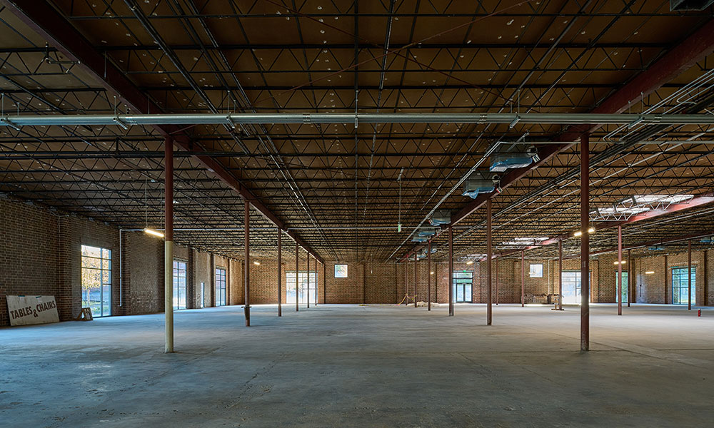 <p>Preserving certain elements of the building, such as the original masonry and high-bay ceiling heights while adding appealing features like oversize windows and skylights position the building to attract a variety of tenants.</p>
