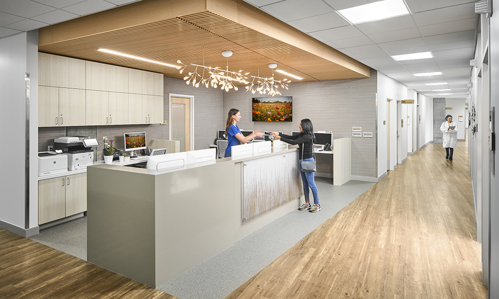 <p>Administration desk and patient room corridor within the Susan Samueli Clinic. </p>

