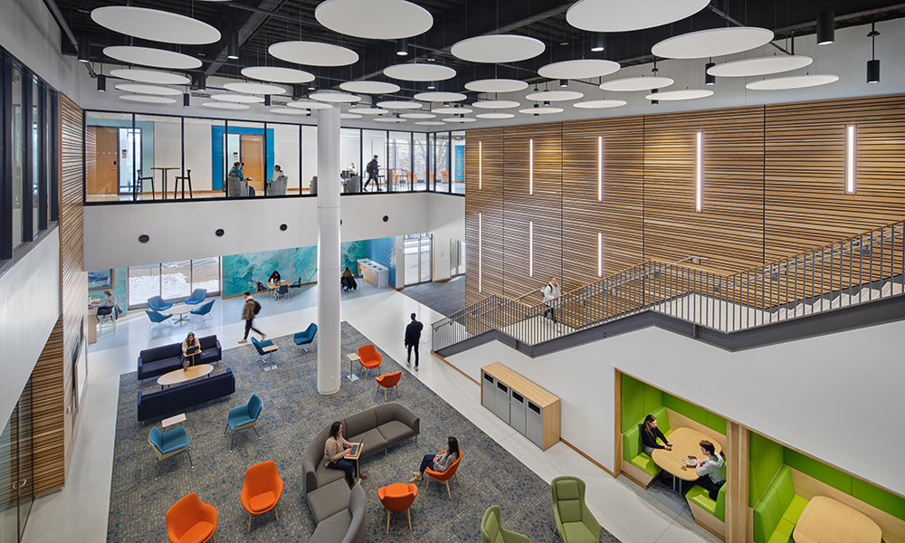<p>A vibrant, light-filled commons anchors the interior, offering flexible study areas, collaborative breakout spaces, and visual connections across multiple levels.</p>
