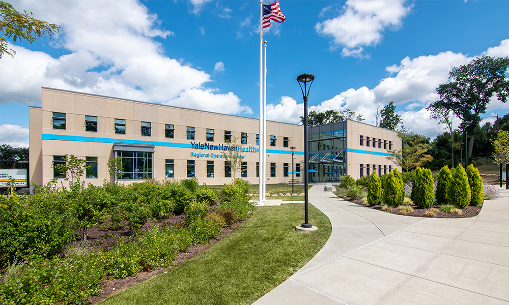 <p>The exterior design of the ROC seeks to reflect the YNHHS brand. The overall response is a building that is forward-looking with clean lines. The large scale of the building is moderated by first recessing the east elevation and utilizing two exterior treatments to break down the mass of the building. </p>
