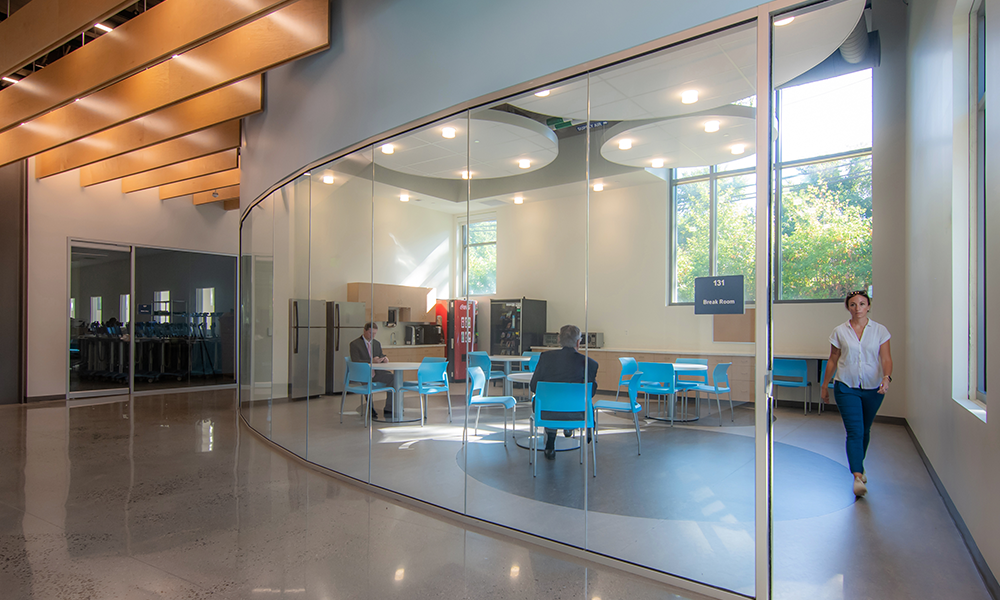 <p>The design team took advantage of the minimalist aesthetic of the warehouse and purposefully brought the industrial feel into the public spaces utilized by staff and visitors daily. </p>
